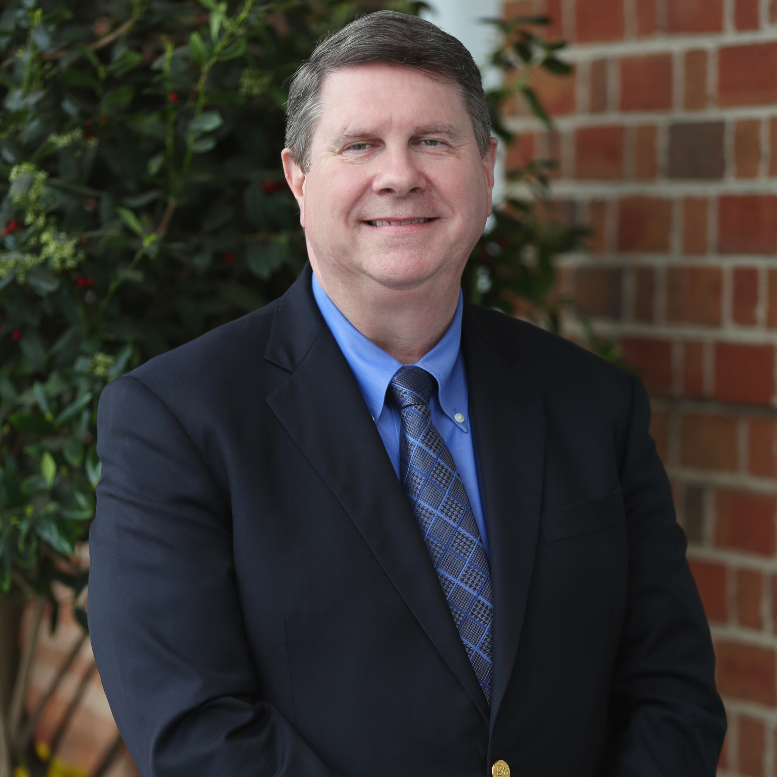 Robert Russell portrait: Professional headshot of Robert Russell, attorney at DeMayo Law, against a neutral background.