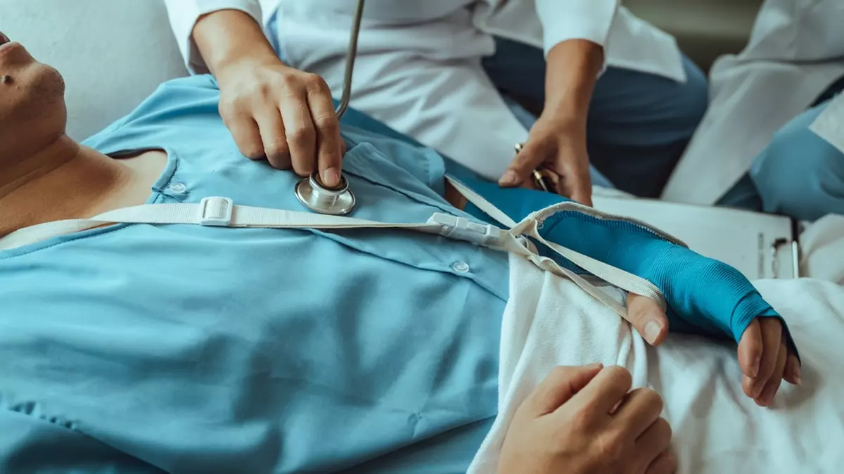 A patient receives medical care after a car accident.